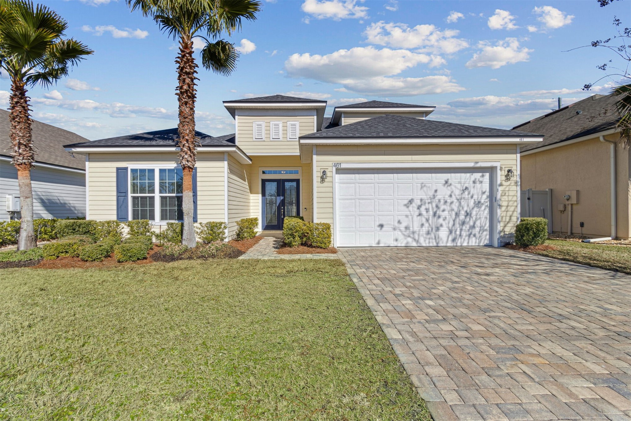 461 Sargasso Street Fernandina Beach, FL 32034 - Photo 1 of 40 a front view of a house with garden