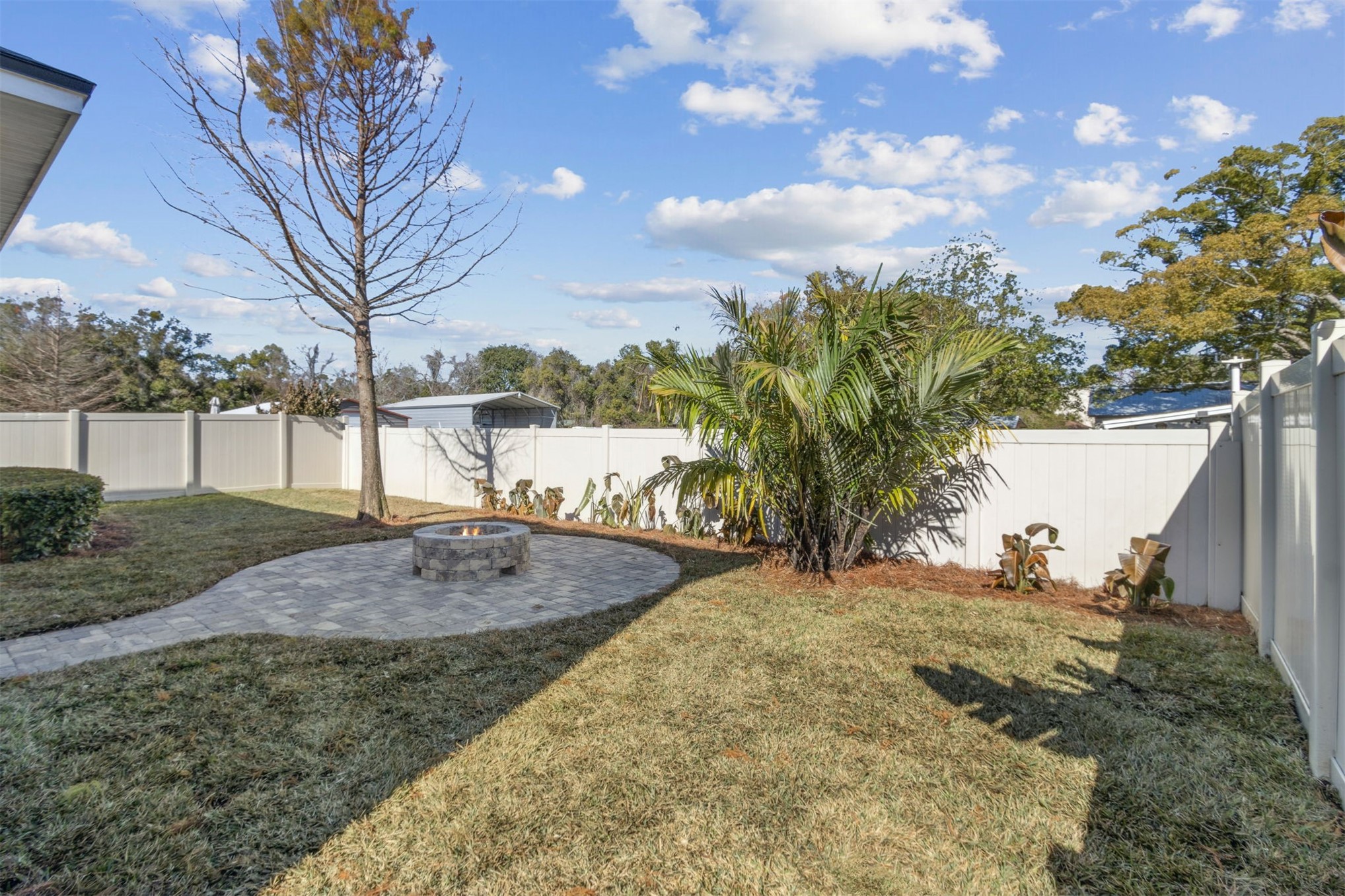 461 Sargasso Street Fernandina Beach, FL 32034 - Photo 23 of 40 a view of yard with swimming pool and trees