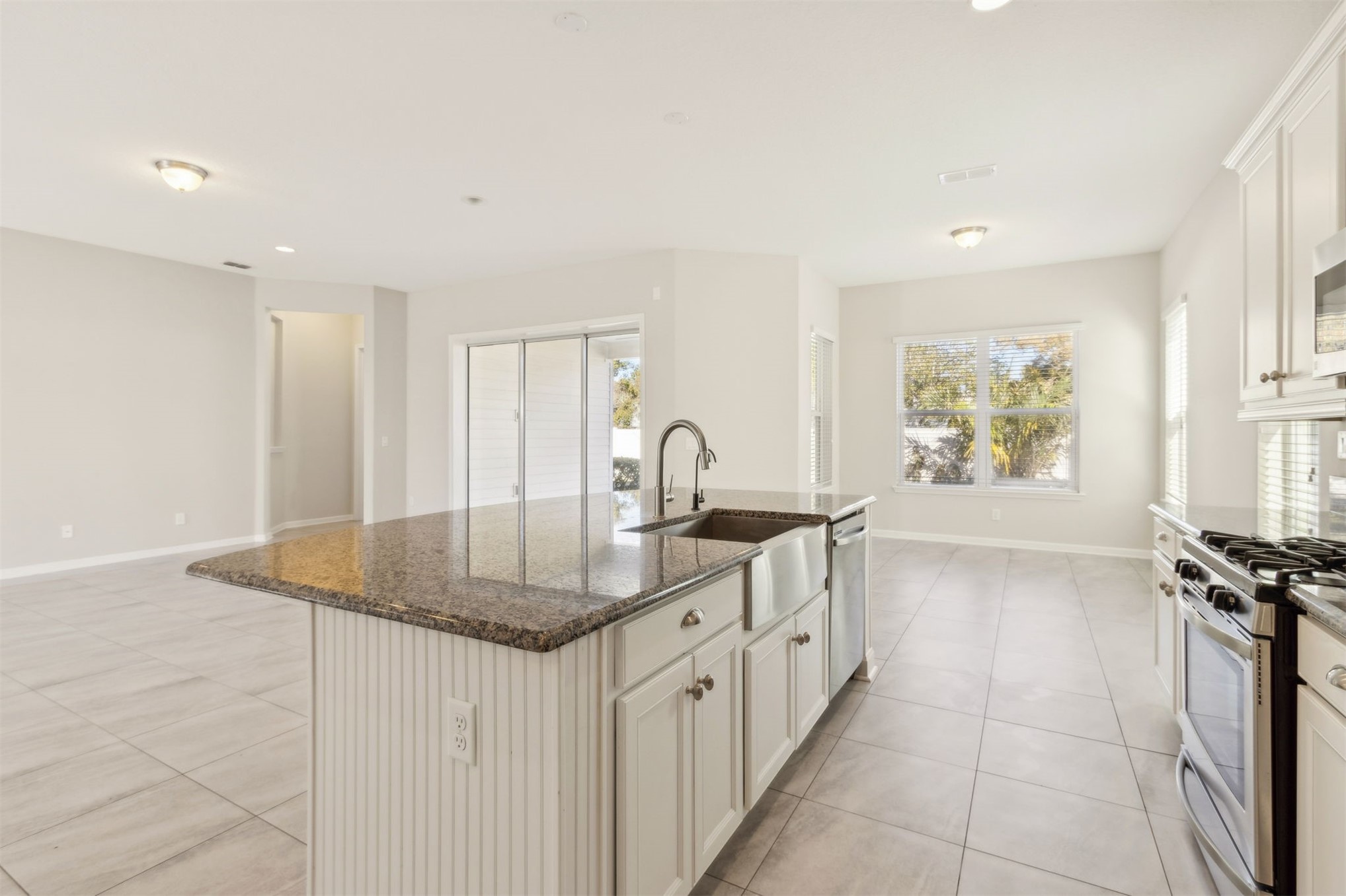 461 Sargasso Street Fernandina Beach, FL 32034 - Photo 30 of 40 a kitchen with stainless steel appliances granite countertop a sink and a stove