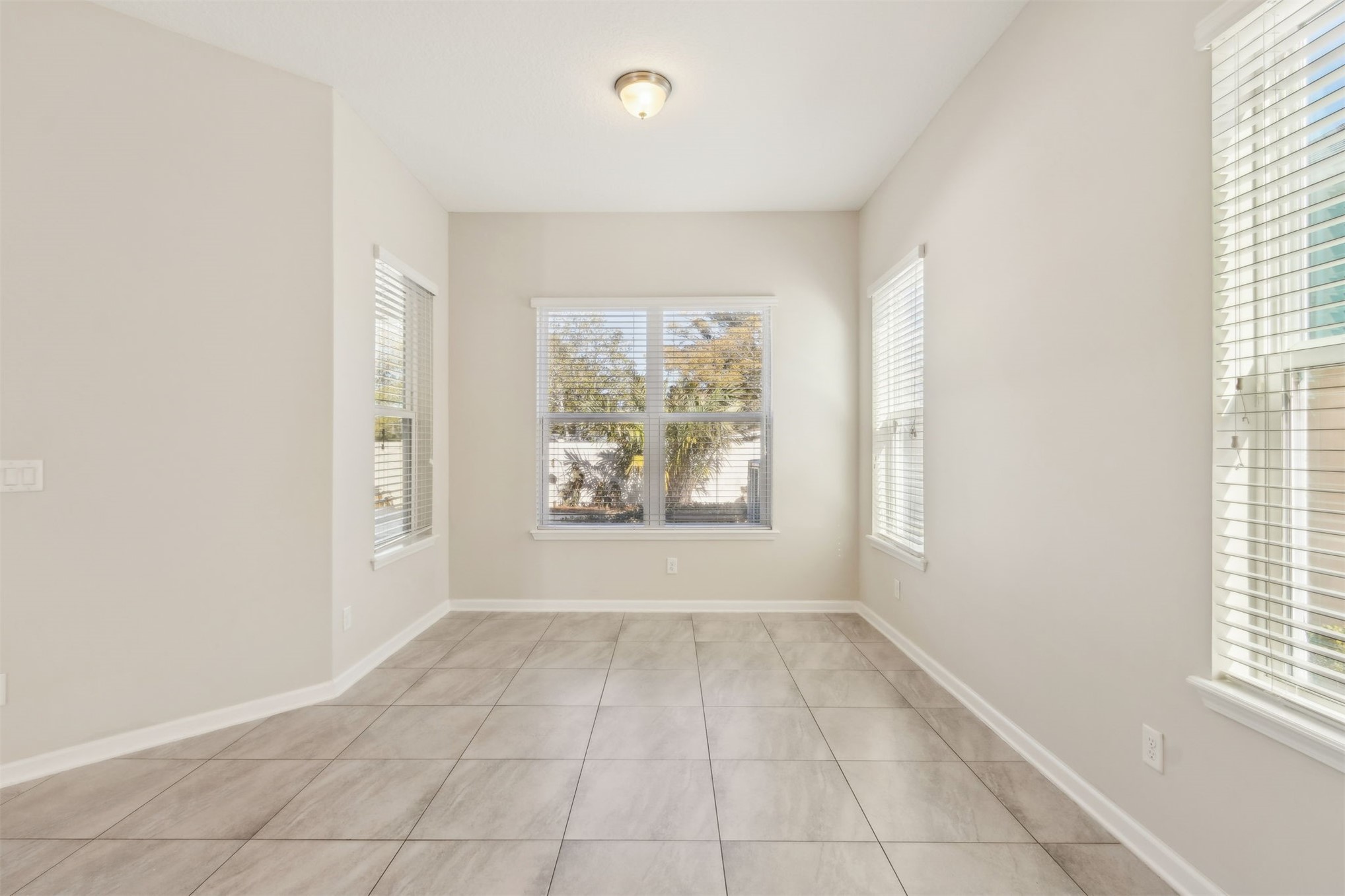 461 Sargasso Street Fernandina Beach, FL 32034 - Photo 32 of 40 an empty room with windows and entrance
