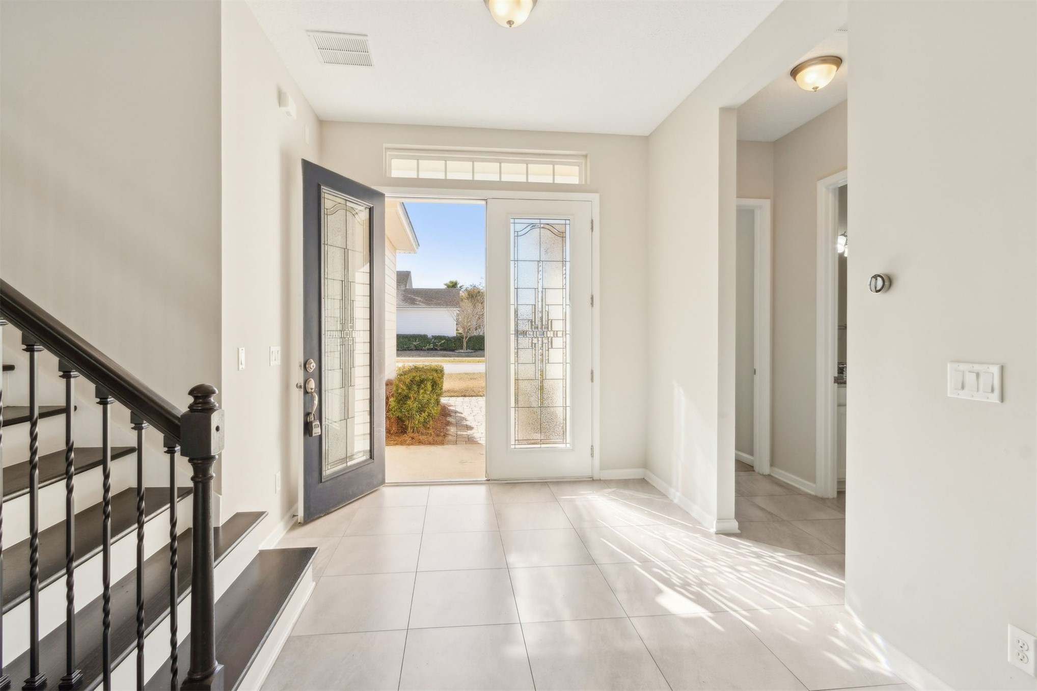 461 Sargasso Street Fernandina Beach, FL 32034 - Photo 35 of 40 a view of a hallway with wooden floor and windows