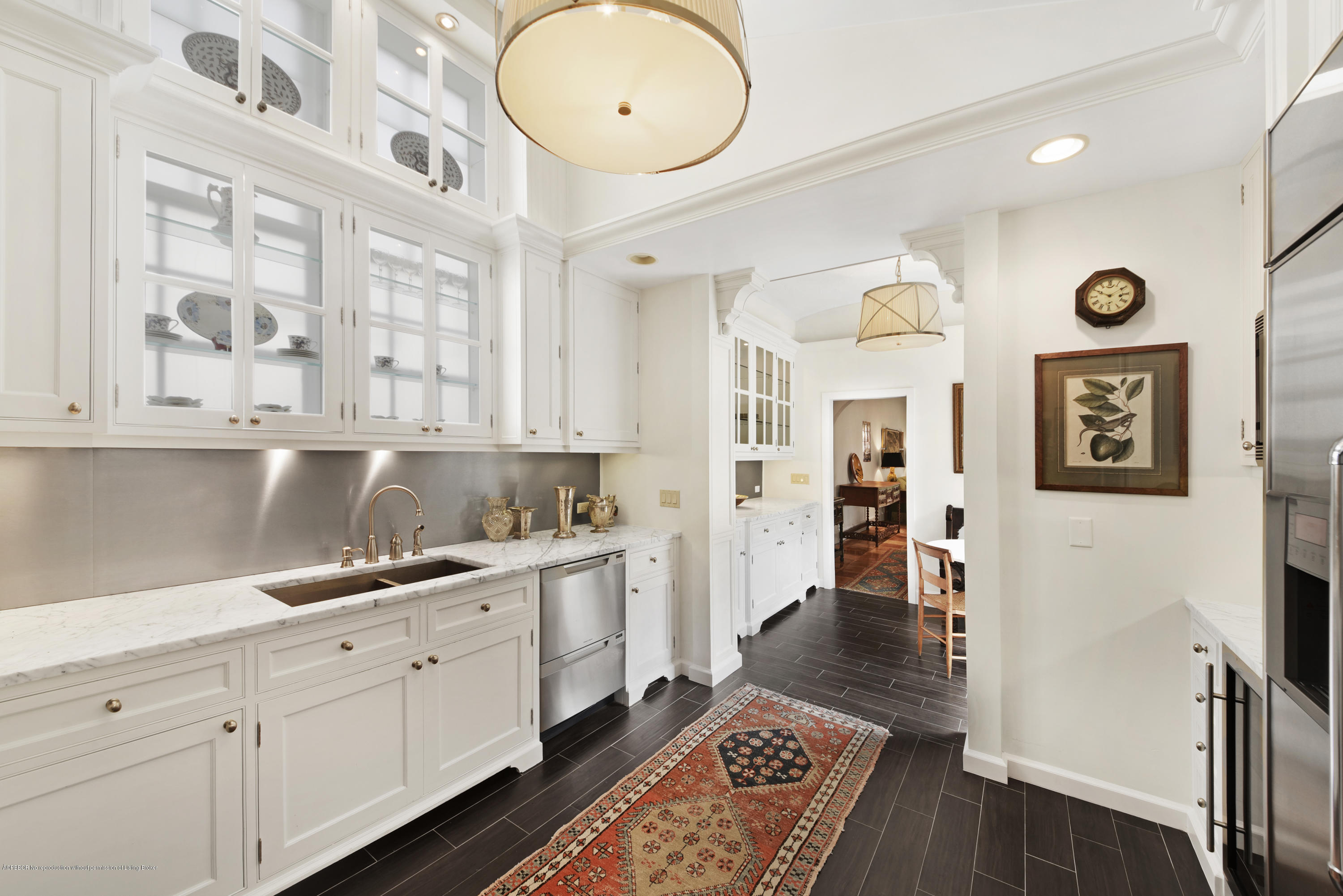 9 Golfview Road Palm Beach, FL 33480 - Photo 16 of 57 a hall with kitchen island a stove a refrigerator and wooden floor