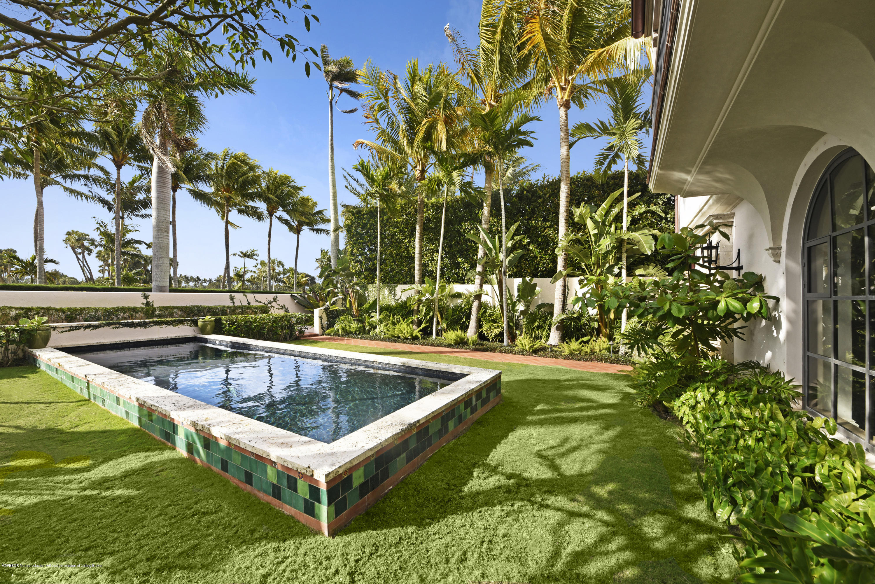9 Golfview Road Palm Beach, FL 33480 - Photo 33 of 57 a view of a swimming pool with a yard