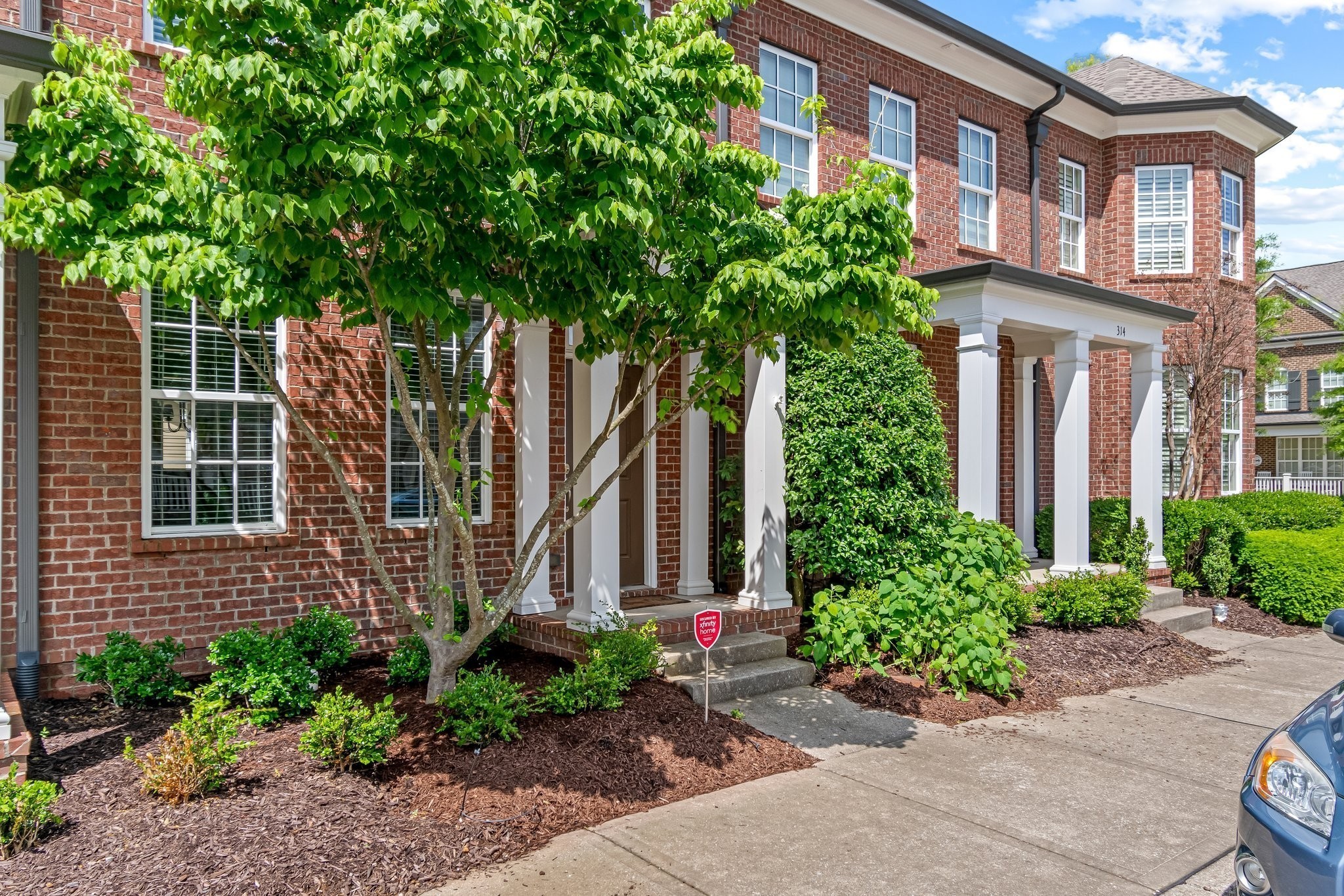 318 Byron Way Franklin, TN 37064 - Photo 2 of 53 a view of a brick building next to a yard