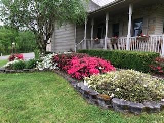 10 Maple Farm Lane Uniontown, PA 15401 - Photo 4 of 21 a view of a house with a yard and garden