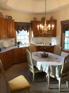 10 Maple Farm Lane Uniontown, PA 15401 - Photo 6 of 21 a kitchen with a dining table chairs and sink