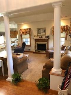 10 Maple Farm Lane Uniontown, PA 15401 - Photo 7 of 21 a living room with furniture a flat screen tv and a fireplace