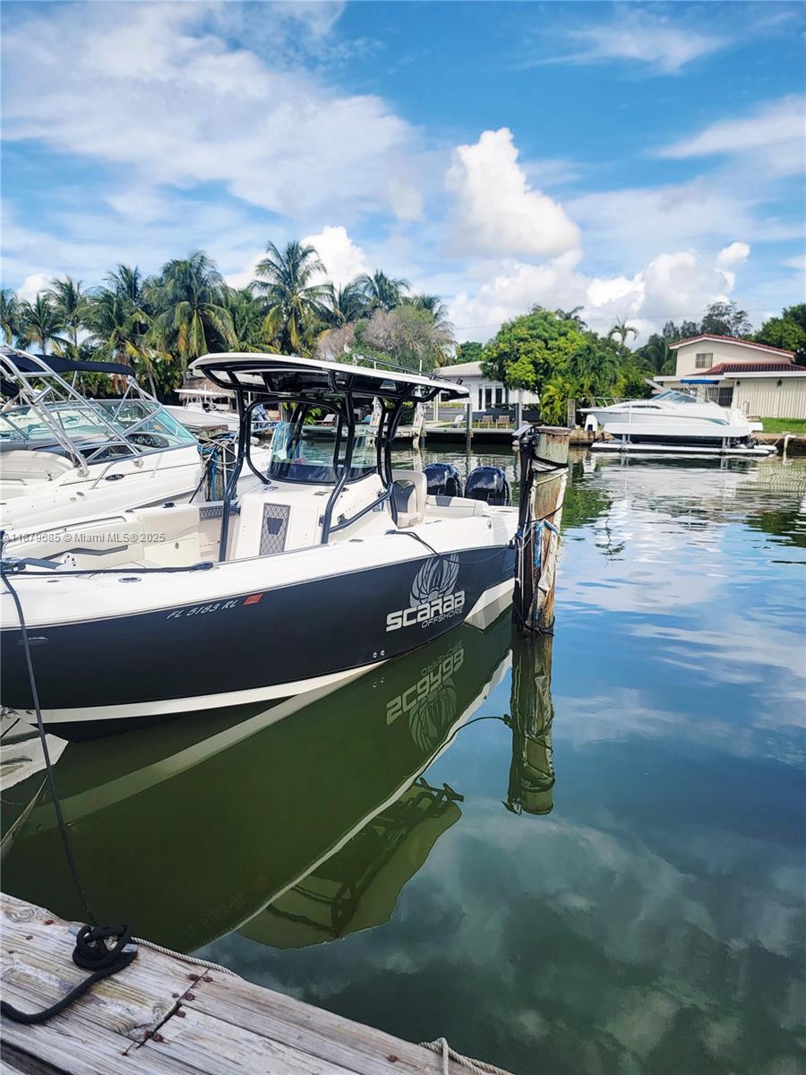 2033 Calais Drive, Unit 7 Miami Beach, FL 33141 - Photo 1 of 1 a view of a swimming pool with a patio