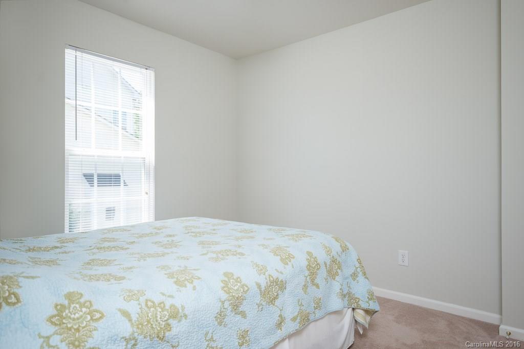 624 Eaton Court Fort Mill, SC 29708 - Photo 13 of 24 a bedroom with a bed and a window