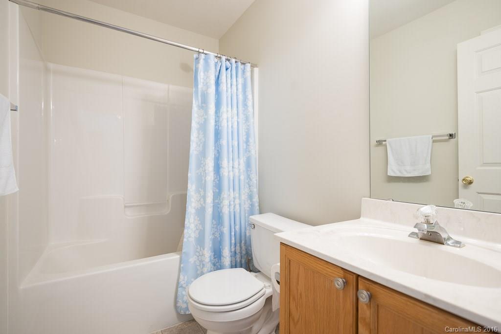 624 Eaton Court Fort Mill, SC 29708 - Photo 14 of 24 a bathroom with a sink a toilet and shower
