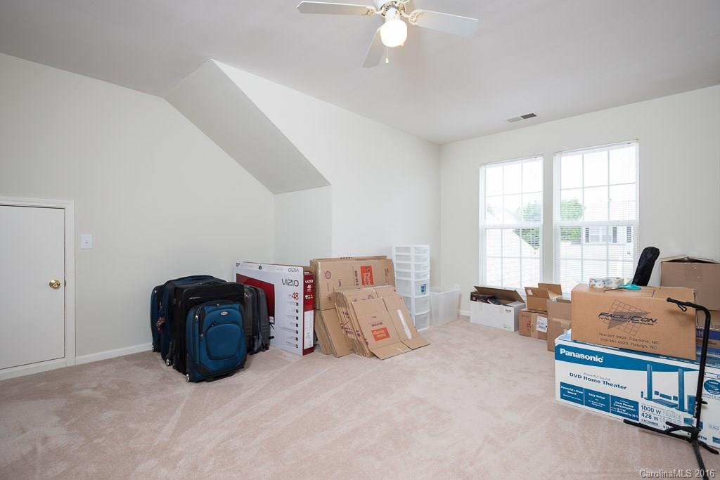624 Eaton Court Fort Mill, SC 29708 - Photo 16 of 24 a bed room with furniture and window