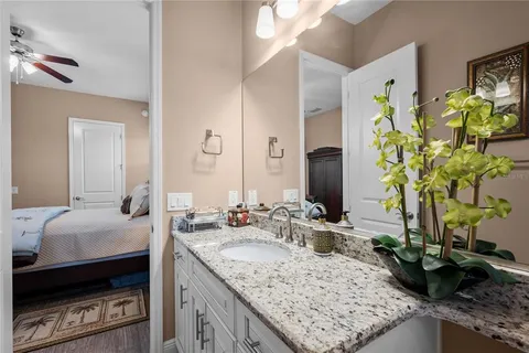 a bathroom with sink and mirror