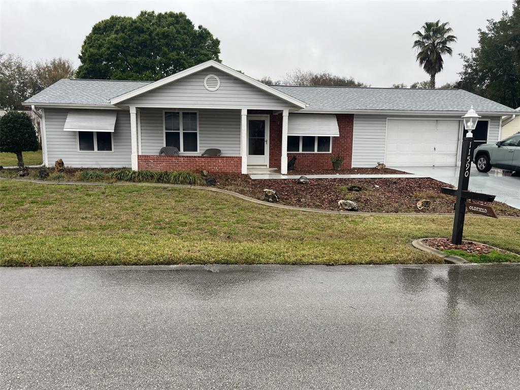 a front view of a house with a yard