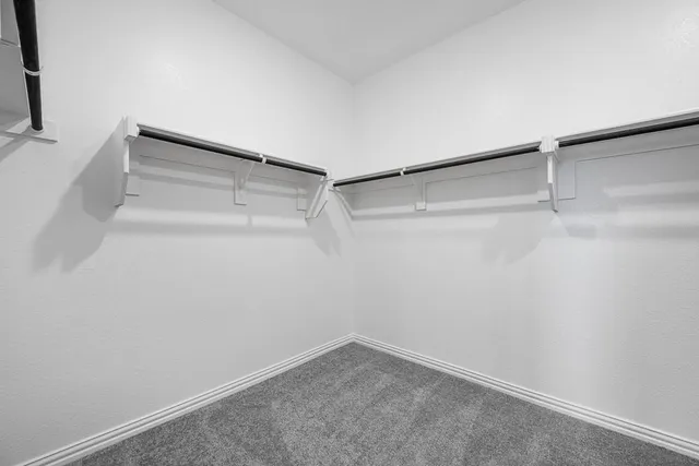 a view of an empty walk in closet