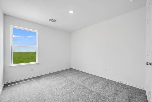 a view of an empty room and entryway