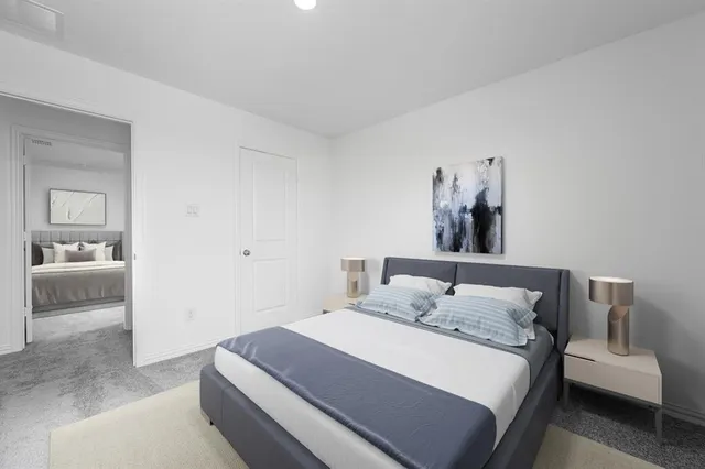 a bedroom with a bed and a couch