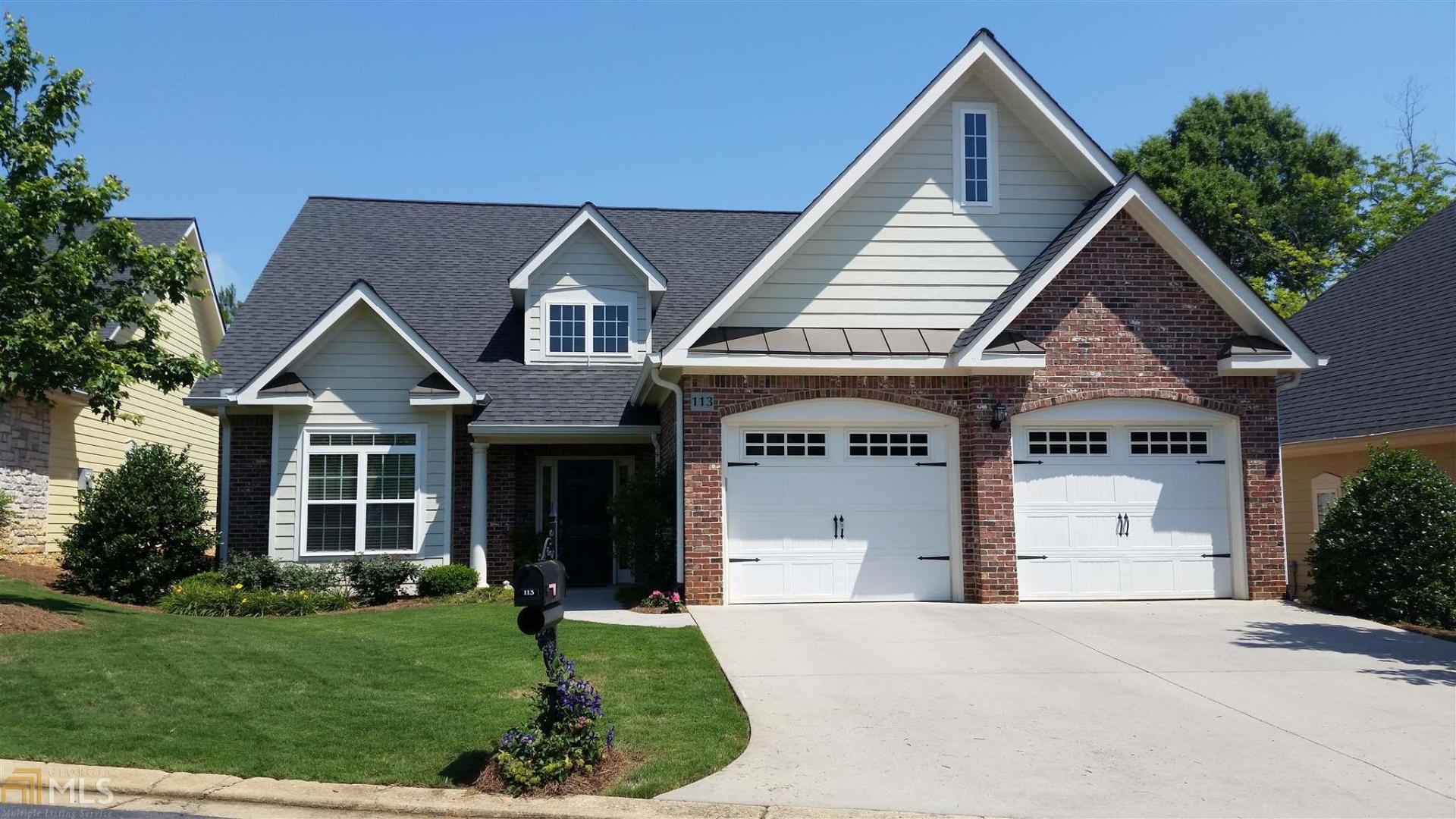 113 Maplecrest Lane Southeast Rome, GA 30161 - Photo 1 of 1 a front view of a house with a yard and garage