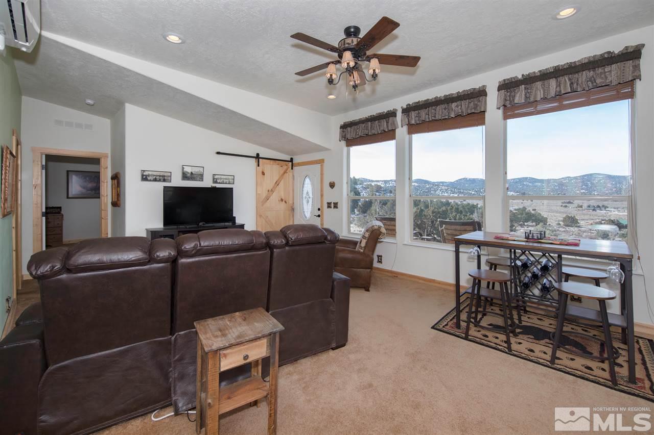 3230 Cartwright Road Reno, NV 89521 - Photo 12 of 25 a living room with furniture and a flat screen tv