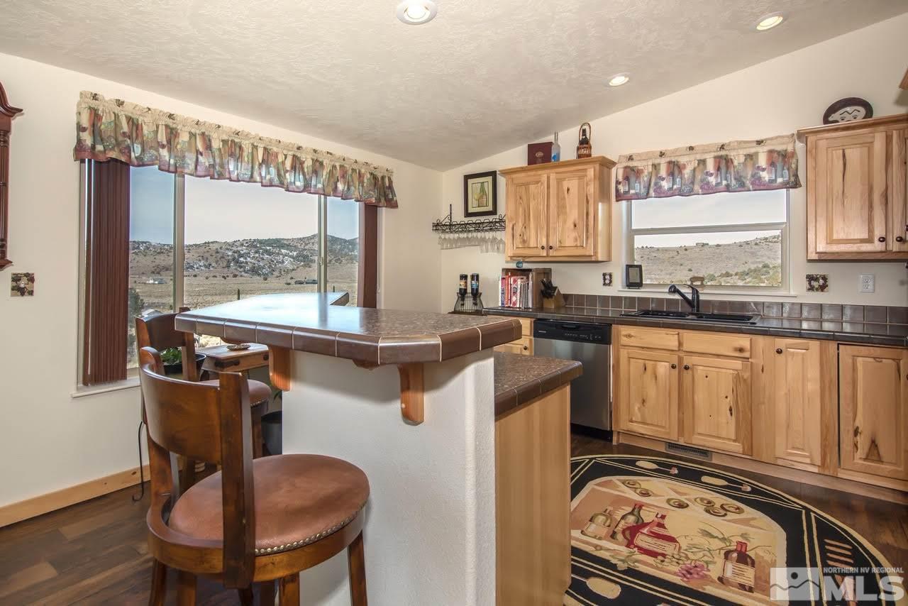 3230 Cartwright Road Reno, NV 89521 - Photo 15 of 25 a kitchen with a stove a sink and a refrigerator
