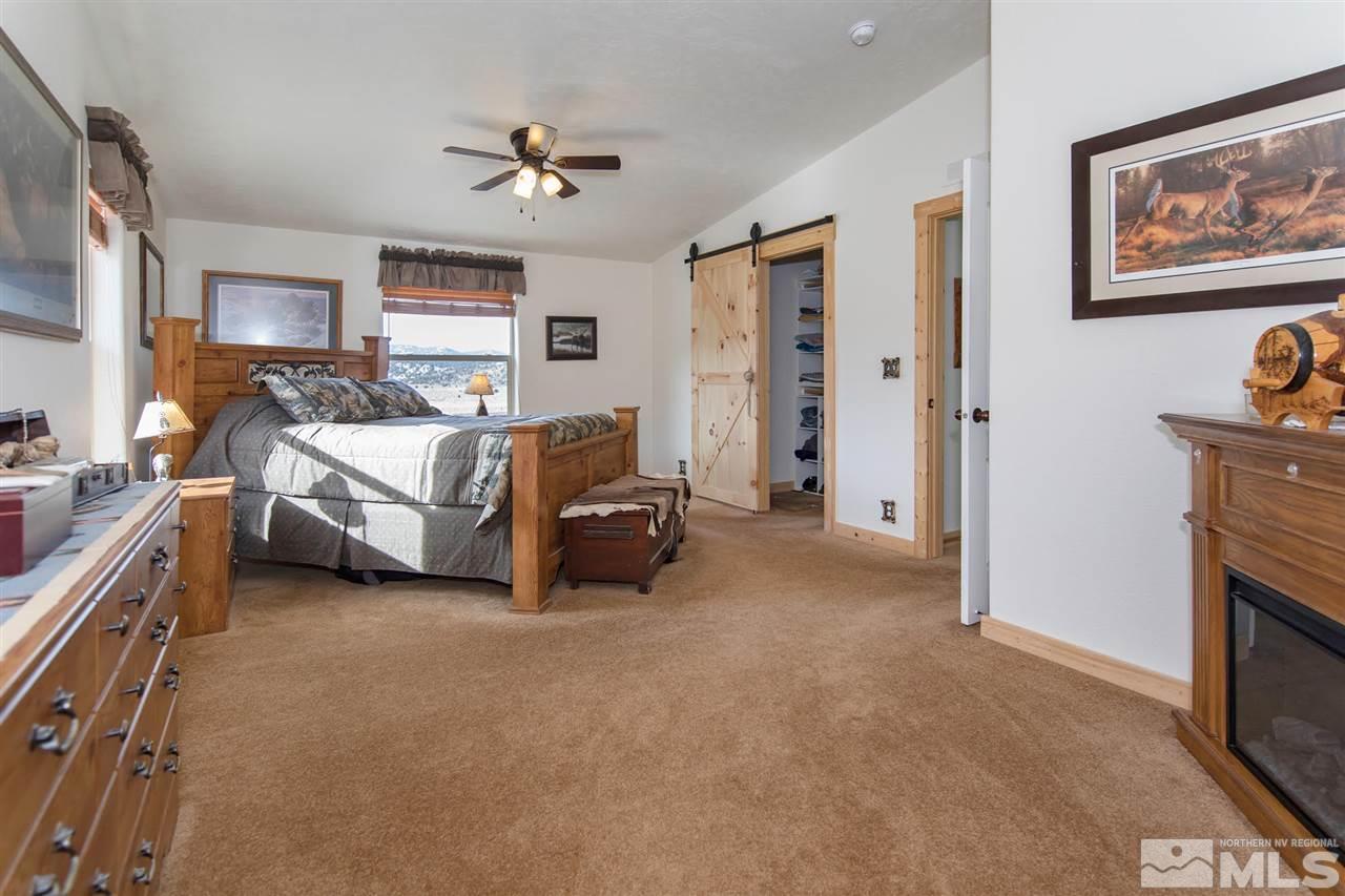 3230 Cartwright Road Reno, NV 89521 - Photo 18 of 25 a living room with furniture and a flat screen tv