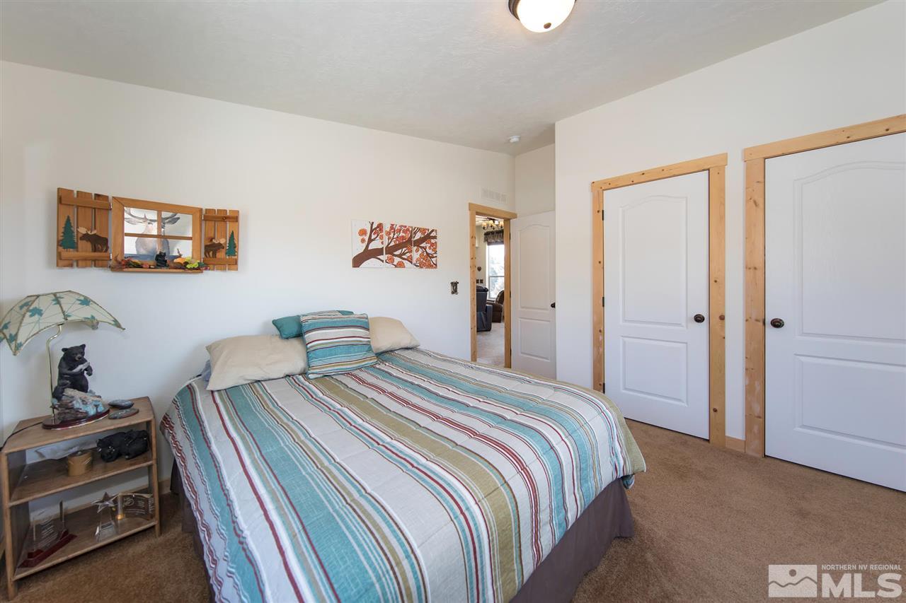 3230 Cartwright Road Reno, NV 89521 - Photo 22 of 25 a bedroom with bed and a flat screen tv