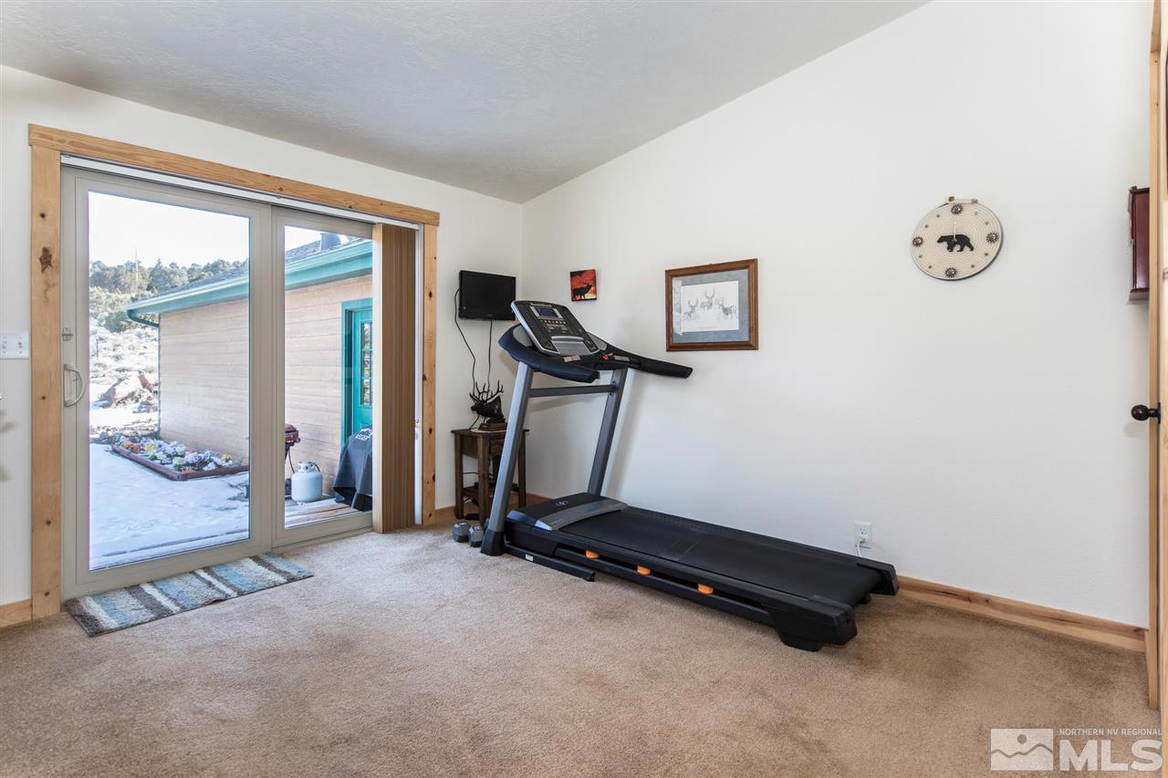 3230 Cartwright Road Reno, NV 89521 - Photo 24 of 25 a room with gym equipment and a large window