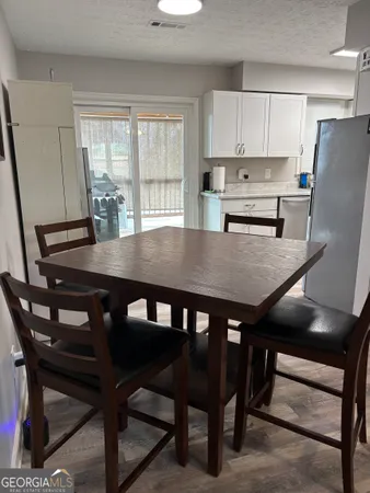 a view of a dining room with furniture