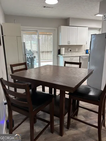a view of a dining room with furniture