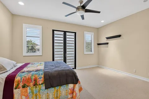 an aerial view of a houses with a yard