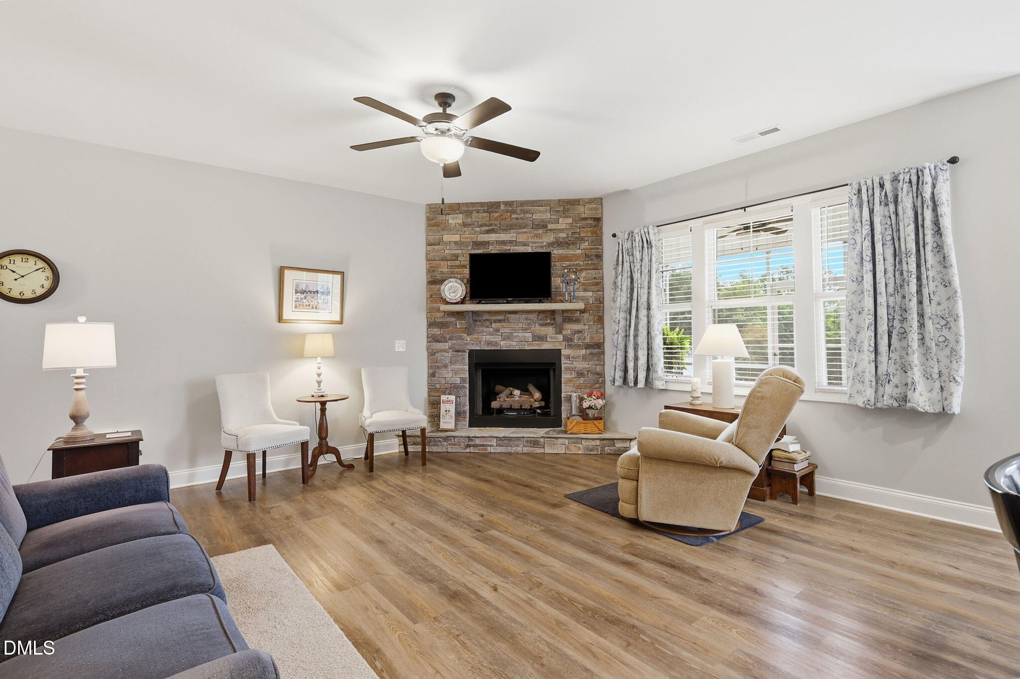 5098 Spring Hill Church Road Lillington, NC 27546 - Photo 5 of 36 a living room with furniture and a fireplace