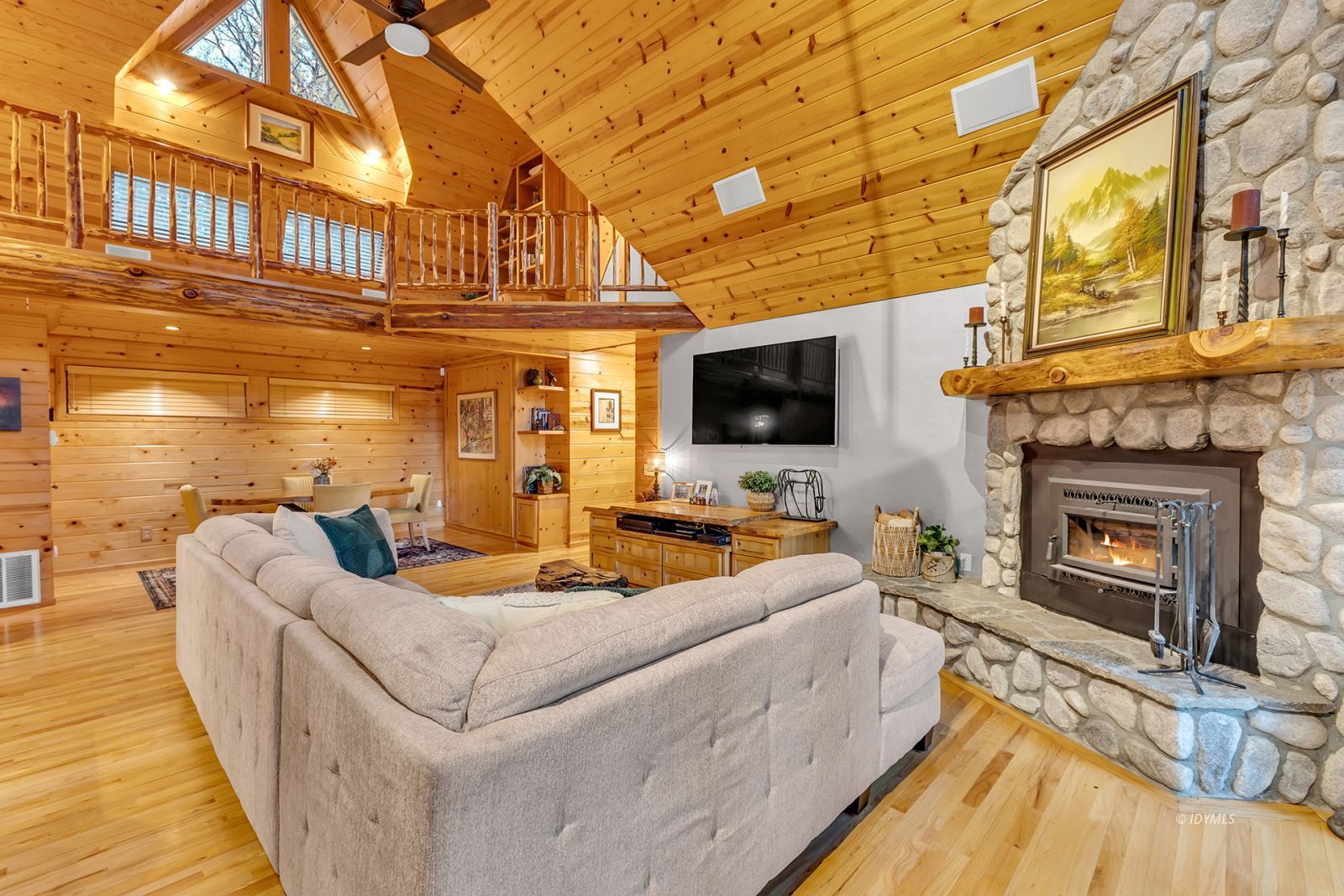 26620 Pine Avenue Idyllwild, CA 92549 - Photo 21 of 43 a living room with fireplace furniture and a flat screen tv