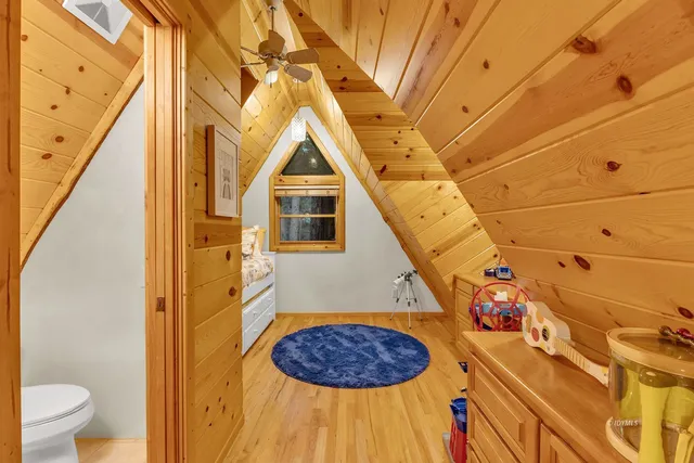 a view of a bathroom with a sink and wooden floor