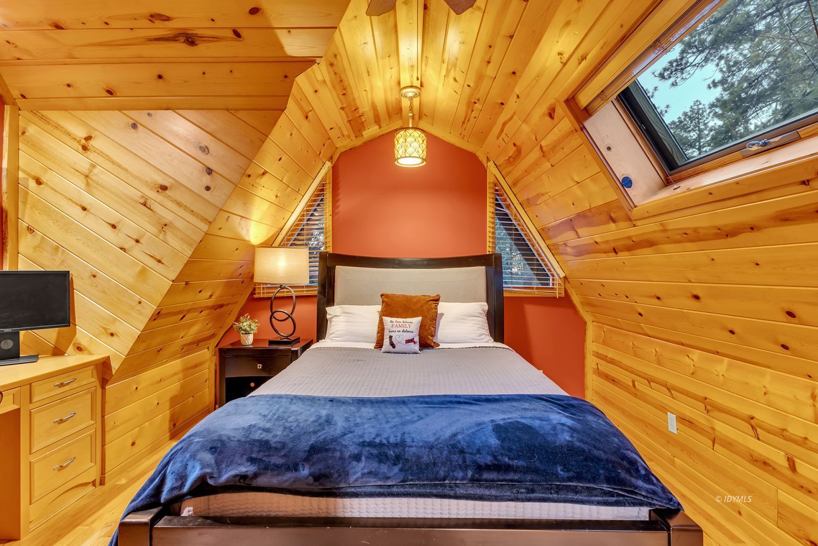 26620 Pine Avenue Idyllwild, CA 92549 - Photo 37 of 43 a bedroom with a bed and wooden floor