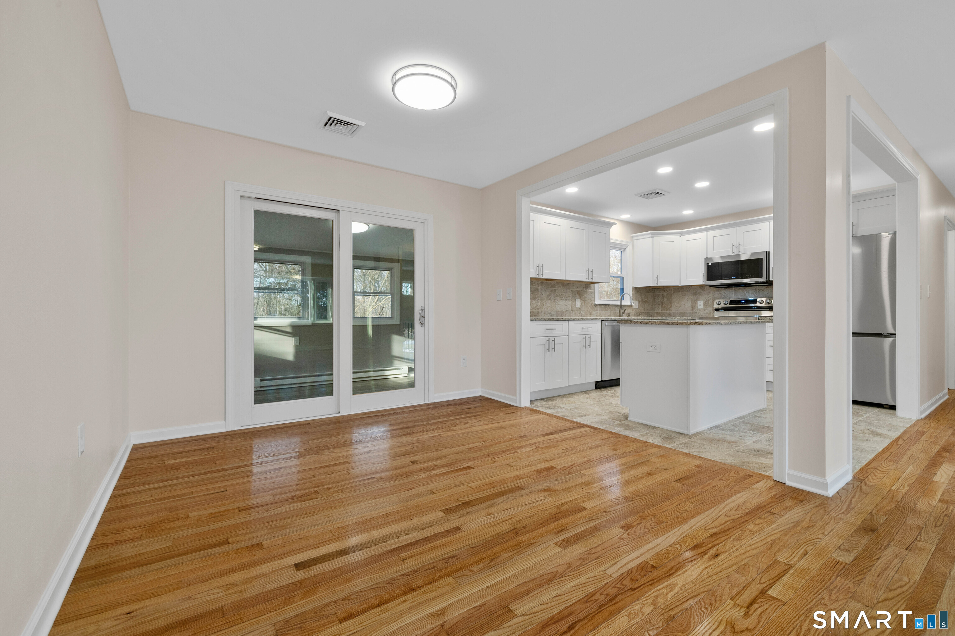 31 Branch Hill Road Preston, CT 06365 - Photo 11 of 40 a view of a kitchen with wooden floor and a kitchen