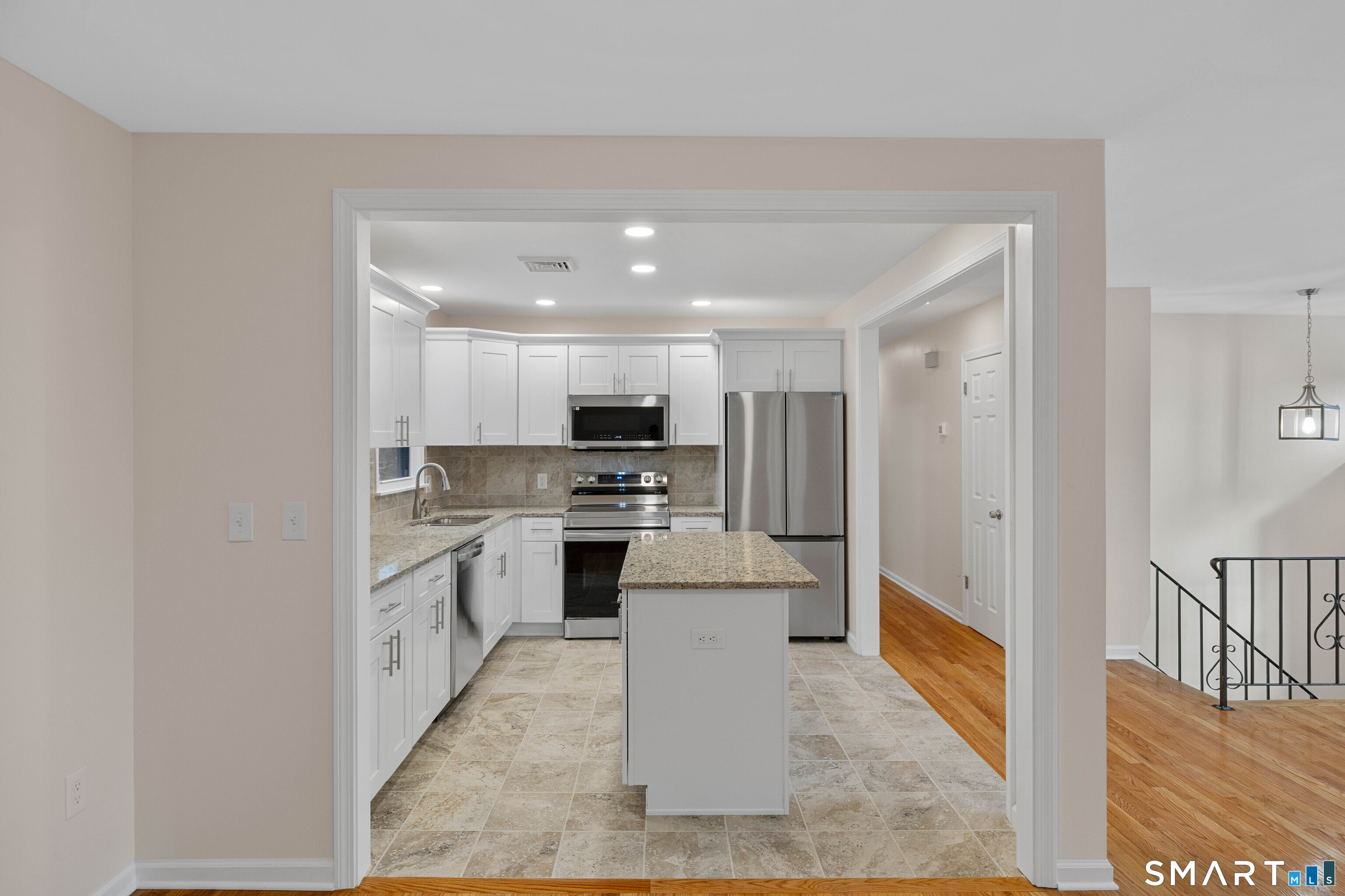 31 Branch Hill Road Preston, CT 06365 - Photo 15 of 40 a large white kitchen with stainless steel appliances granite countertop a refrigerator and stove top oven