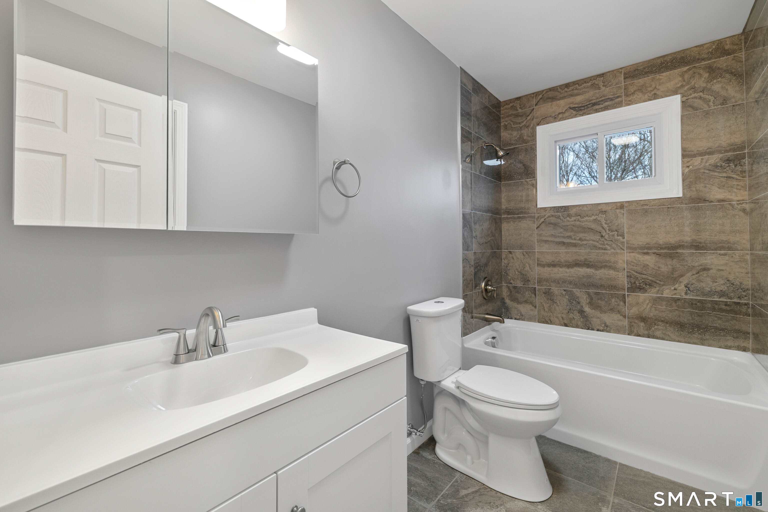 31 Branch Hill Road Preston, CT 06365 - Photo 22 of 40 a white toilet sitting next to a bathroom sink