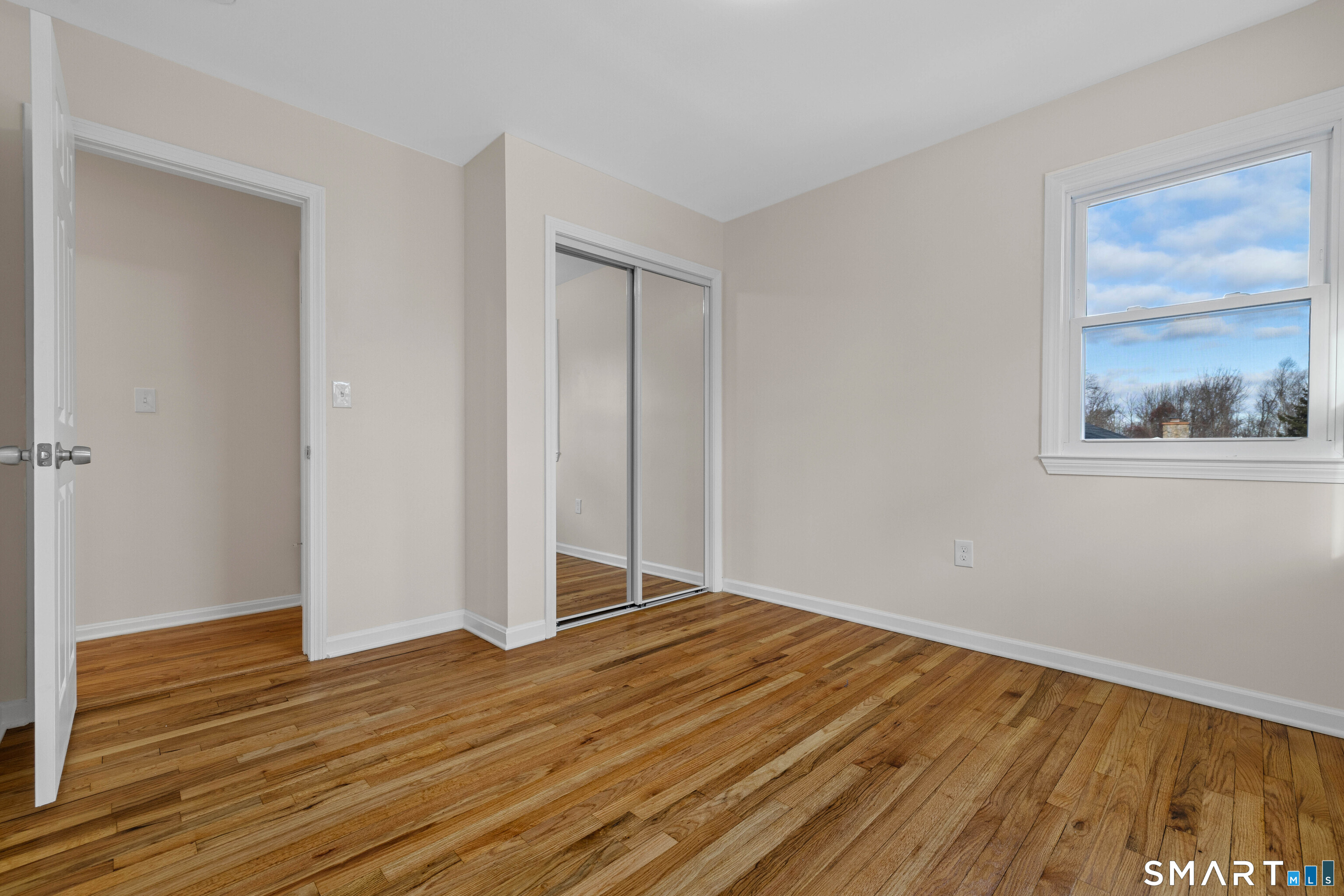 31 Branch Hill Road Preston, CT 06365 - Photo 26 of 40 a view of an empty room with wooden floor and a window