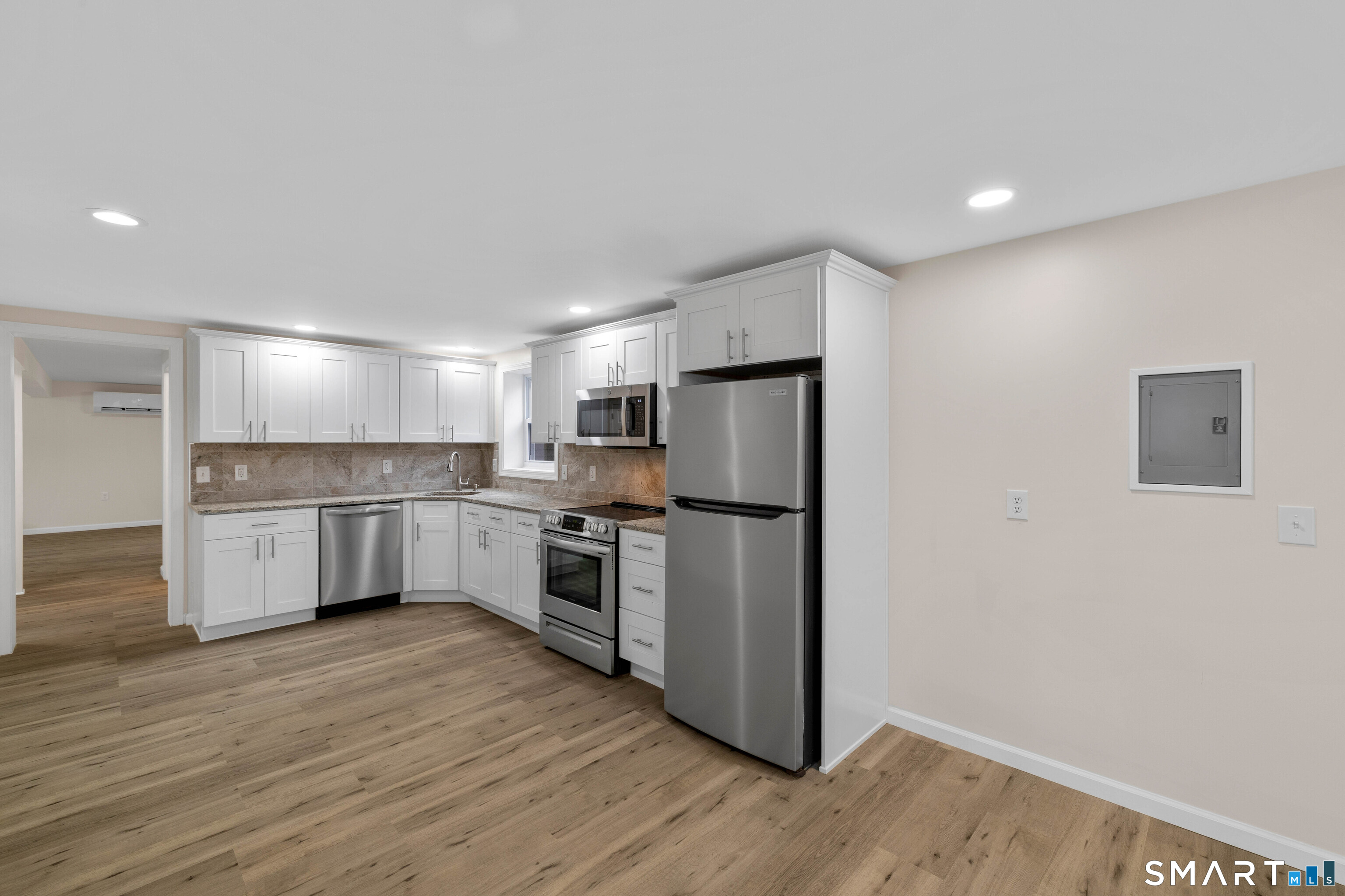 31 Branch Hill Road Preston, CT 06365 - Photo 30 of 40 a kitchen with a refrigerator and a stove top oven