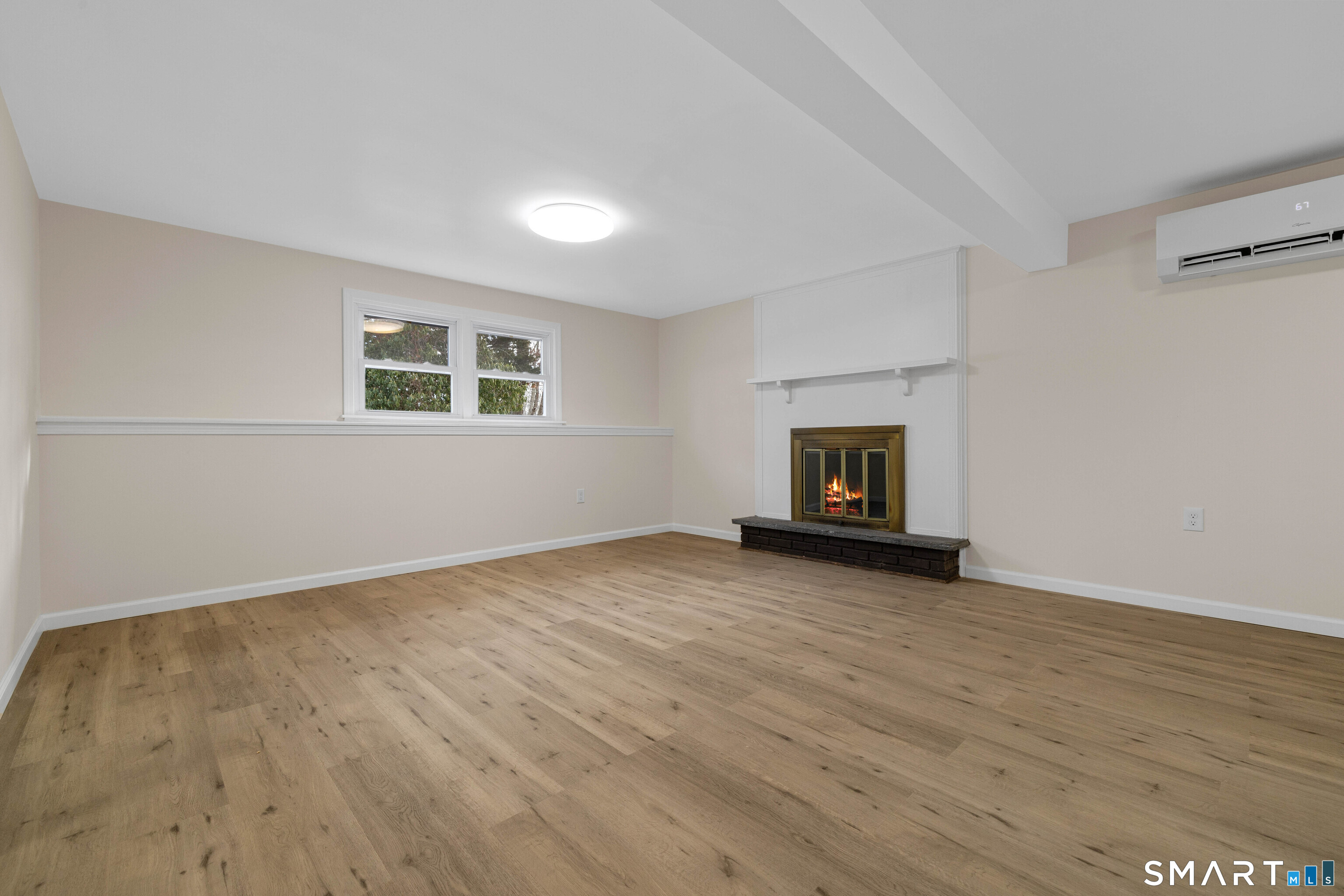 31 Branch Hill Road Preston, CT 06365 - Photo 32 of 40 a view of an empty room with wooden floor and a window