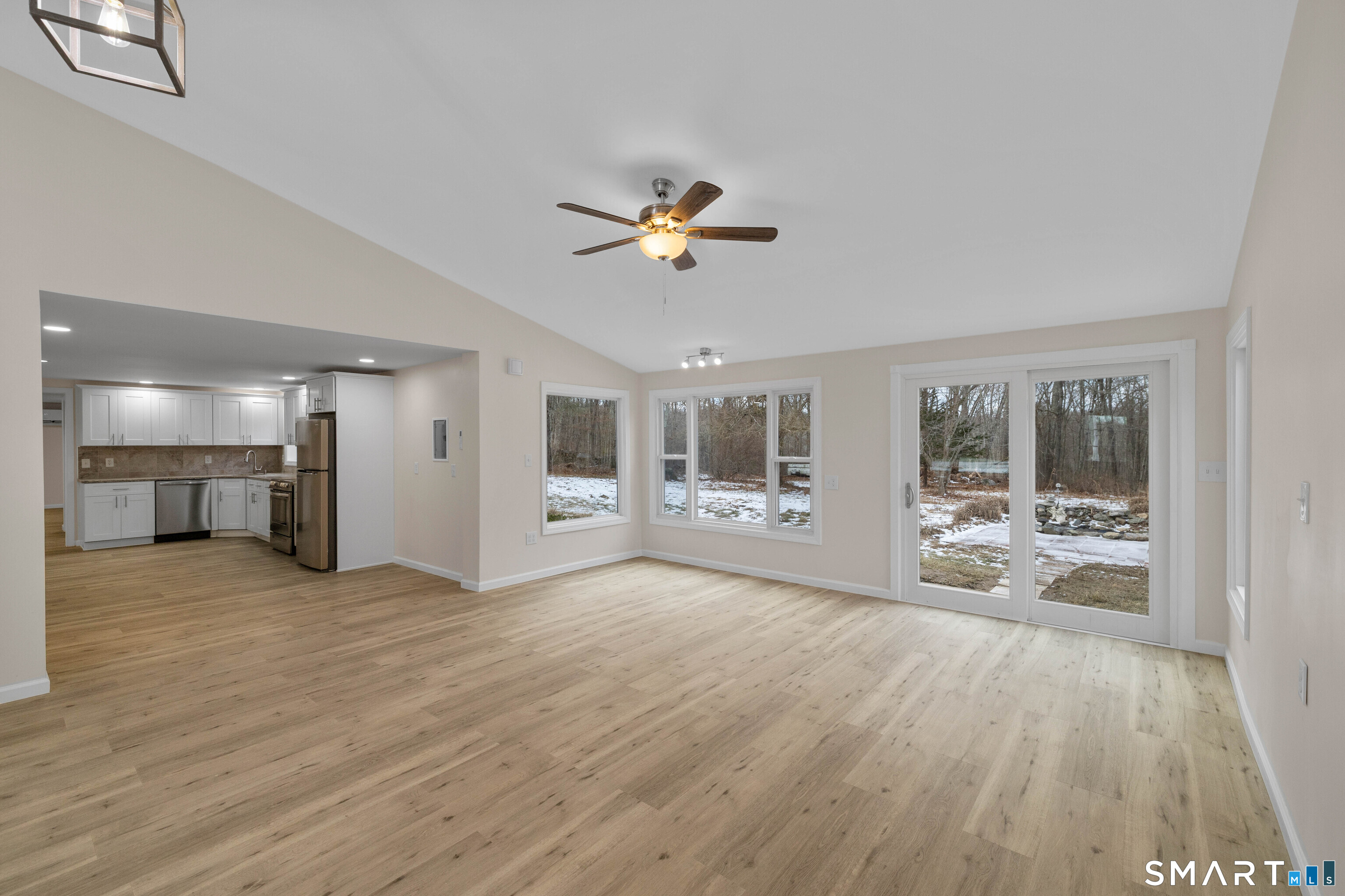 31 Branch Hill Road Preston, CT 06365 - Photo 34 of 40 a view of a livingroom with wooden floor and a ceiling fan