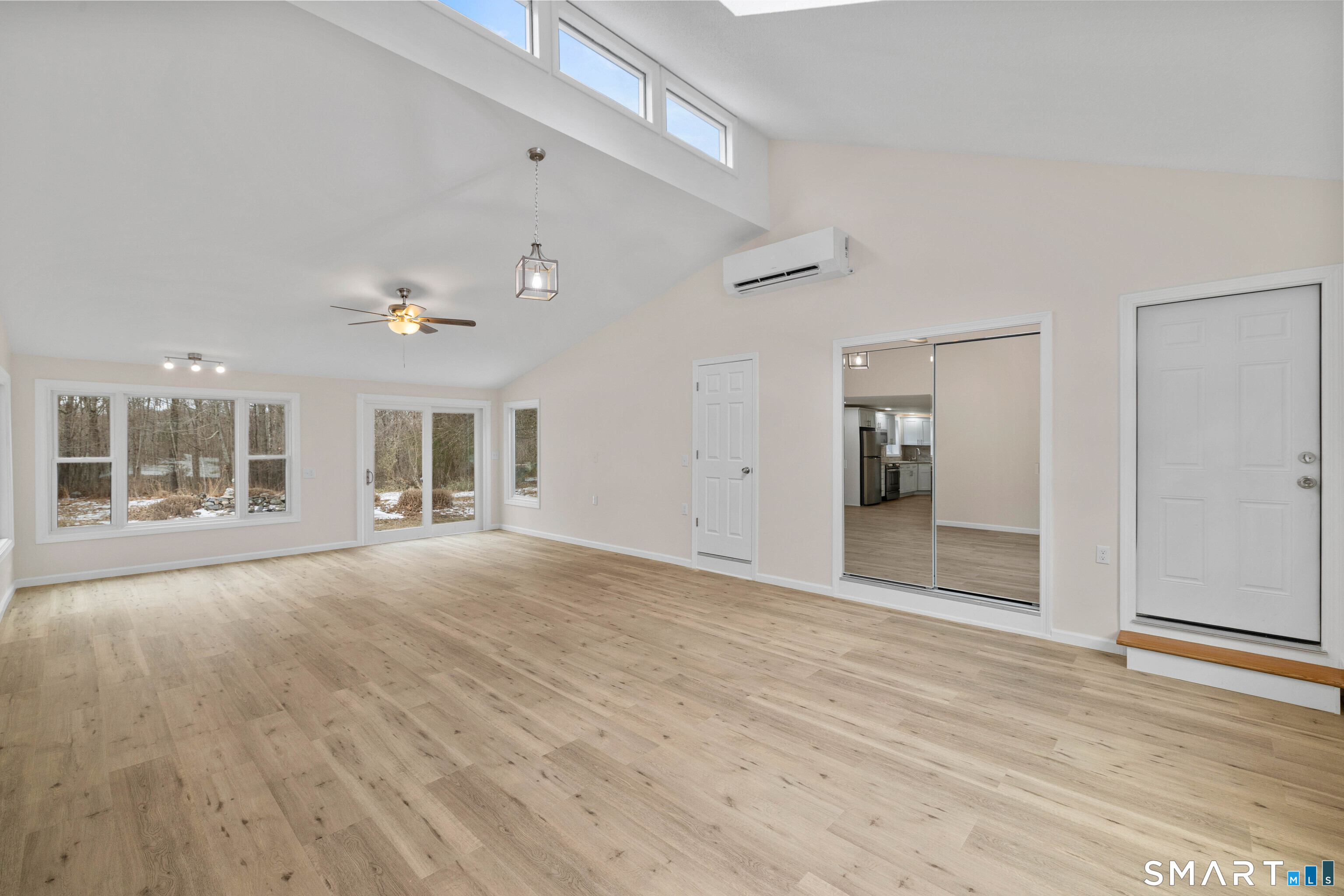 31 Branch Hill Road Preston, CT 06365 - Photo 36 of 40 a view of an empty room with wooden floor and a window