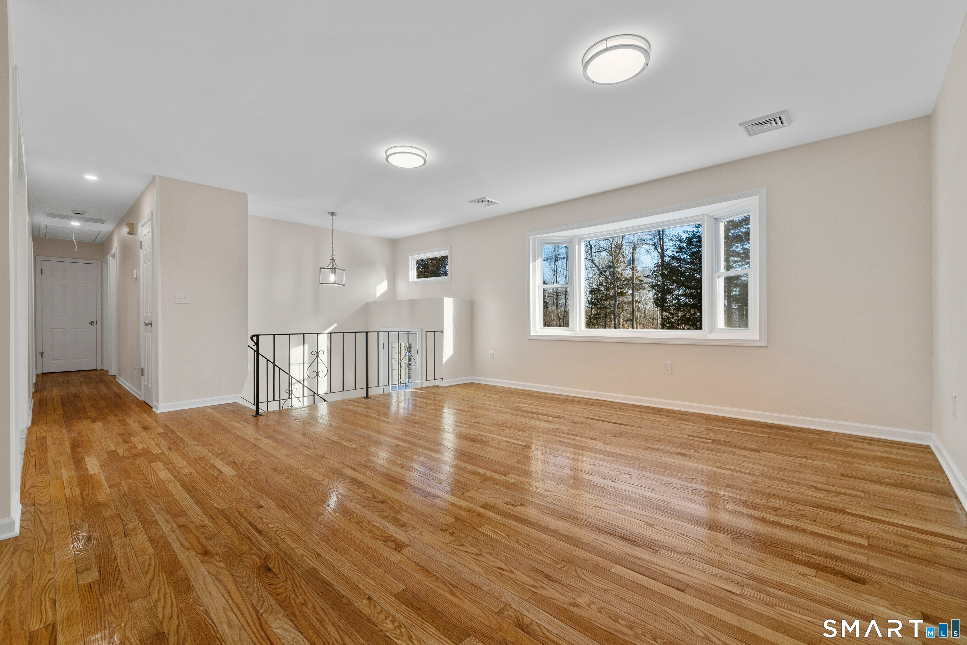 31 Branch Hill Road Preston, CT 06365 - Photo 9 of 40 a view of an empty room with wooden floor and a window