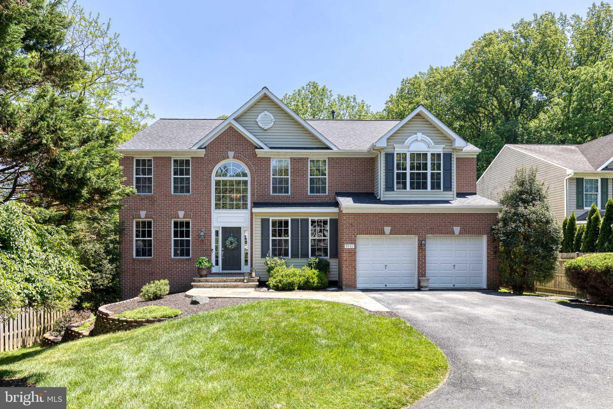 9741 Starling Road Ellicott City, MD 21042 - Photo 1 of 64 Charming brick home with lush greenery.