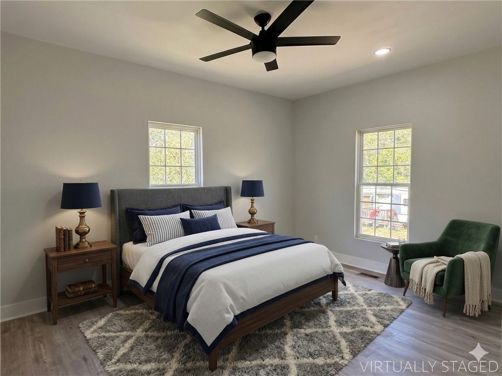 115 Hunter Street Anderson, SC 29625 - Photo 14 of 21 Bright and airy, this bedroom provides a tranquil retreat with ample natural light.