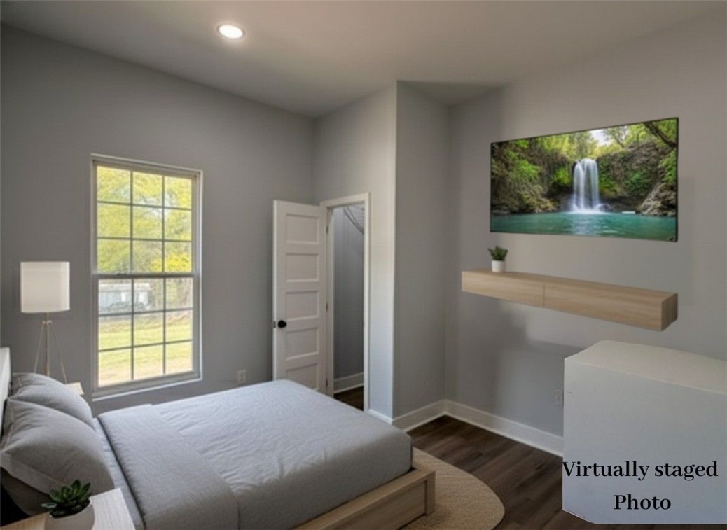 115 Hunter Street Anderson, SC 29625 - Photo 17 of 21 Bright and airy bedroom features recessed lighting and ample natural light from a large window.