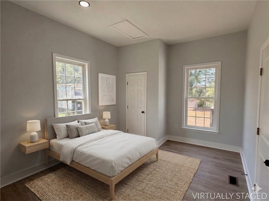 115 Hunter Street Anderson, SC 29625 - Photo 18 of 21 This bright and airy bedroom features ample natural light and modern flooring.
