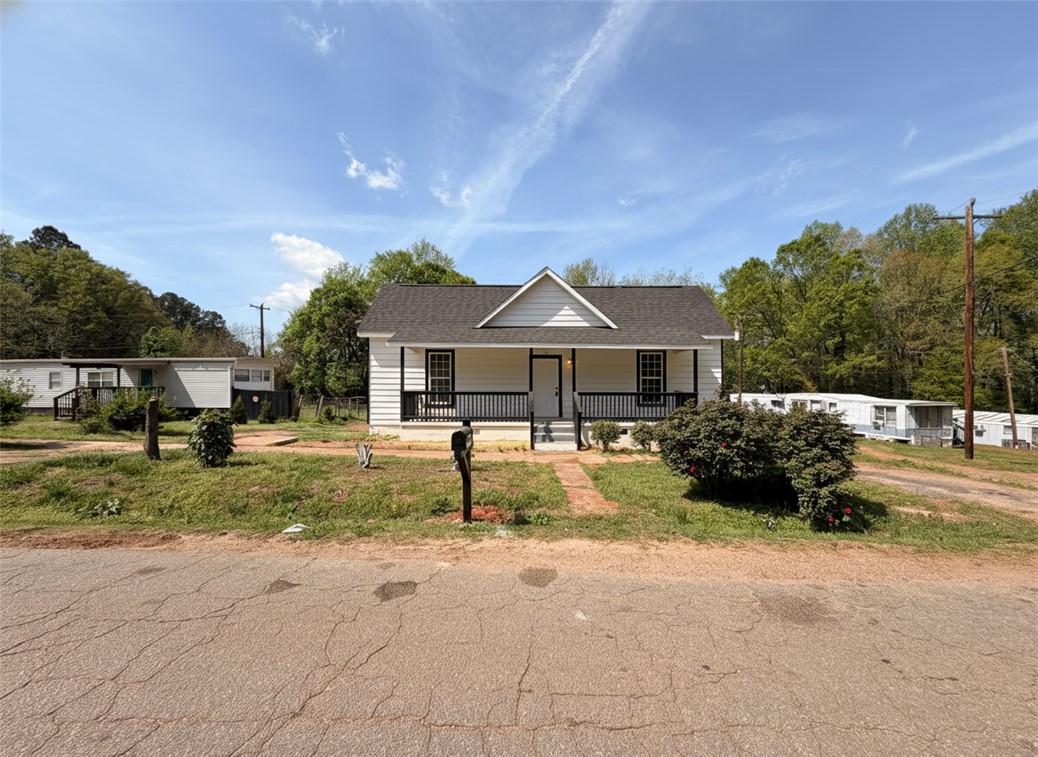 115 Hunter Street Anderson, SC 29625 - Photo 19 of 21 This charming home offers a welcoming facade with a covered porch, perfect for outdoor enjoyment.