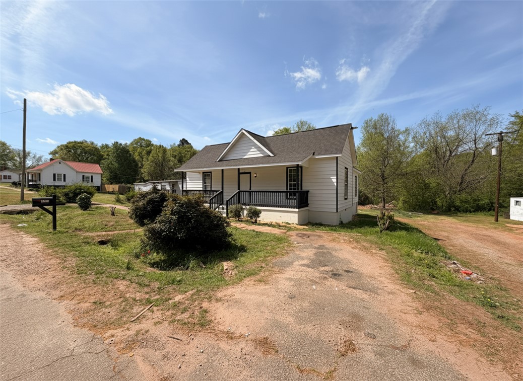 115 Hunter Street Anderson, SC 29625 - Photo 2 of 21 This charming home features a welcoming porch, perfect for enjoying peaceful outdoor moments.
