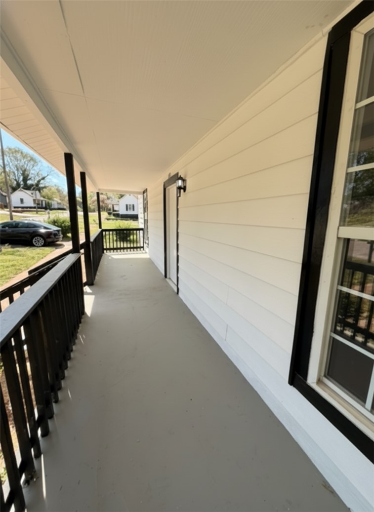 115 Hunter Street Anderson, SC 29625 - Photo 6 of 21 Welcome to this inviting porch, perfect for enjoying quiet mornings or peaceful evenings.
