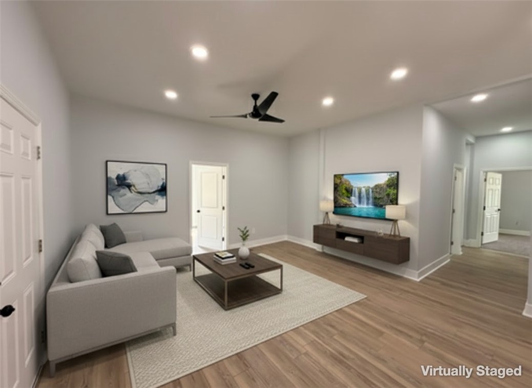 115 Hunter Street Anderson, SC 29625 - Photo 8 of 21 This living area offers both comfort and a clear, modern aesthetic.